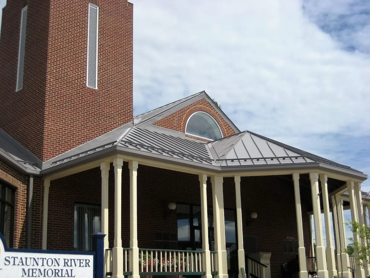 Skilled roofing craftsmen working on a residential roof in Willow Meadows - Willowbend